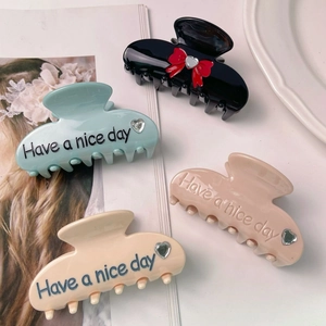 Chic acetate hair claw clip set with bow and lettering in pastel colors for women