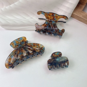 French vintage acetate hair claw set in blue and amber tortoiseshell marble pattern