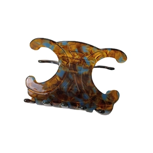 French vintage tortoiseshell hair claw clip with blue marble pattern and Triomphe design