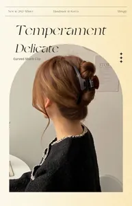 Close-up of a large tortoiseshell acetate claw clip securing a thick French hair bun