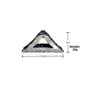 Detail showing dimensions 11.3cm by 5cm of marble acetate triangle hair claw clip