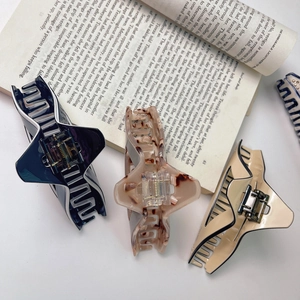 Elegant triangular cutout acetate hair claw clips in tortoise and navy blue colors