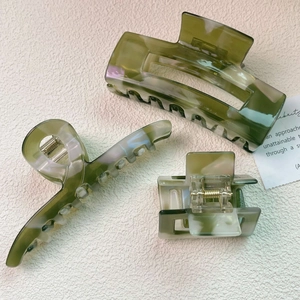 Three-piece olive green marble acetate hair claw set with rectangular and curved clips