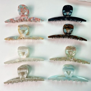 Set of eight 13cm acetate hair claws in marble, tortoiseshell and solid colors