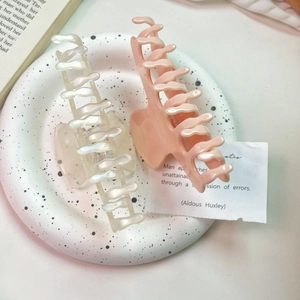 Set of two French acetate hair claws in pearlescent white and soft pink for elegant updos