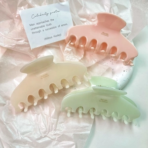 Elegant French acetate hair claws in macaron pink, beige, and mint green colors