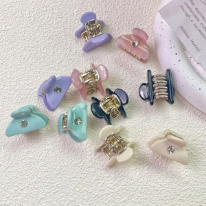 Mini candy-colored acetate hair clips with rhinestones in assorted macabre colors