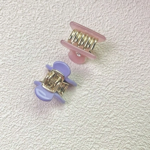 Mini candy-colored acetate hair claws with rhinestones in pink and purple colors