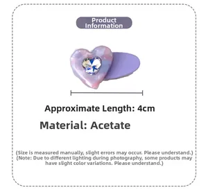 Detail view of 4cm acetate heart hair clip featuring purple marble texture and crystal