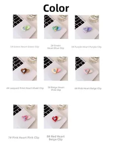 Detail view showing eight colors of acetate heart hair clips with sparkling rhinestone inlay