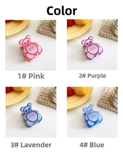 Nahaufnahme von bärenförmigen Haarklammern in Pink und Blau mit Jelly-Textur