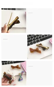 Close-up of acetic acid bow hair clip showing golden metal barrette and French engraving