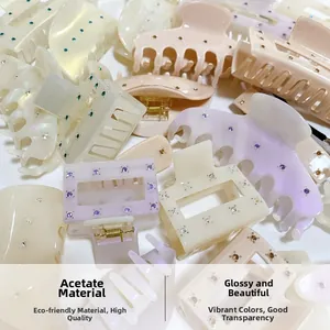 Detail of colorful rhinestone acetate hair claws in assorted pastel colors