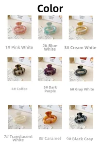 Multiple colors of striped acetate hair claws in a grid display showing various patterns