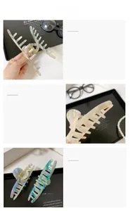 Macro detail of pearlescent acetate hair claws with premium France Handmade engraving