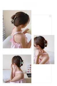 Large marbled resin hair claw clips for women shown in a stylish back-of-head hairstyle