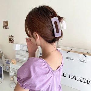 Elegant light purple acetate hair claw clip with rhinestones shown on model hair