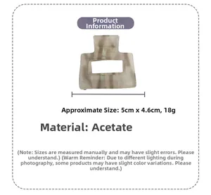 Detail view of square acetate hair claw with marble texture and 5cm by 4.6cm dimensions