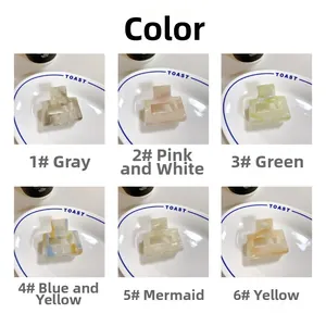 Detailed grid view of assorted marble textured acetate rectangular hair claw clips