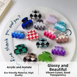 Selection of 13 colorful acrylic and acetate hair clips with checkered patterns on a ceramic plate