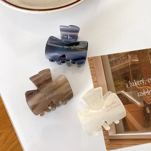 French style acetate claw clip set with marble texture and golden Barrette La France text