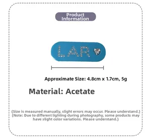 Detail showing blue acetate hair clip dimensions 4.8cm with rhinestone LAR and heart
