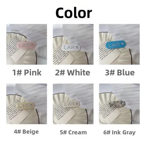 Detailed grid view of assorted colorful acetate hair clips with LAR heart lettering