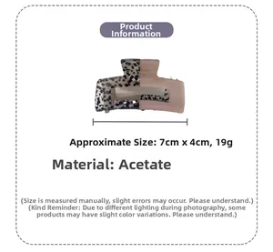 Detail showing acetate hair claw clip dimensions of 7x4cm and black pink color block