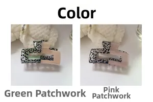 Detail view of patchwork acetate hair claws in green and pink with a vintage pattern