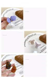 Détail de mini pinces à cheveux ailes d'ange en couleurs pastel avec finition brillante