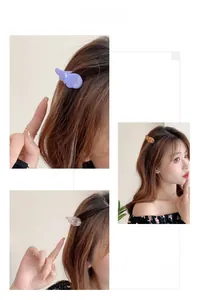 Trois vues de pinces à cheveux ailes d'ange en acétate avec strass sur un modèle