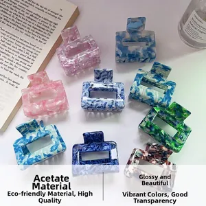 Detailed collection of square acetate hair claws in various elegant marble and forest patterns