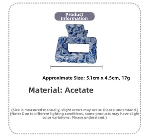 Detail view of square acetate hair claw with blue marble texture, sized 5.1cm by 4.5cm