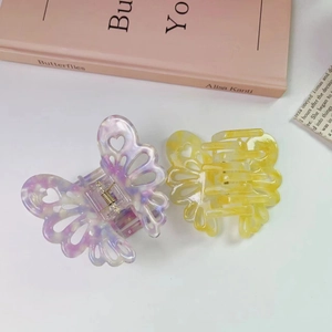 Set di 2 eleganti mollette per capelli a farfalla in acetato marmorizzato viola e giallo