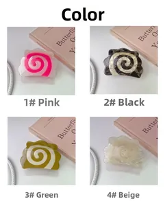 Variety of spiral narutomaki shark hair claws in pink, black, green, and beige colors
