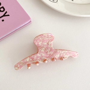 Pink and white marble texture acetate hair claw clip for elegant updo hairstyling