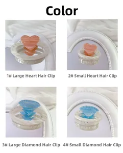 Detail view of heart and diamond shaped hair claws with rhinestone accents in four styles