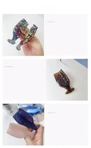 Detailed macro view showing diverse acetate hair claw clips in whale tail shape designs