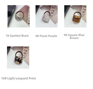 Detailed macro view of four different tortoiseshell acetate hair ties in stylish textures