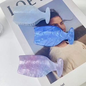 Three elegant wine-glass shaped acetate hair claws in pearlized blue and purple with glitter