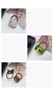 Detailed macro view of stylish resin hair ties with assorted textures and patterns