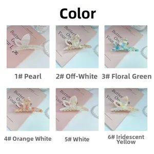Collection of six acetate butterfly claw clips in various marble textures and colors