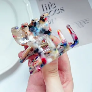 Elegant butterfly acetate hair claw clip with colorful marble pattern for women