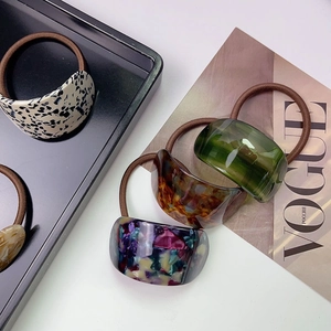 Chic acetate ponytail holders in tortoiseshell and mosaic patterns for women