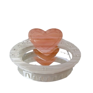 Elegant cream acetate hair claw with large pink heart and sparkling rhinestones