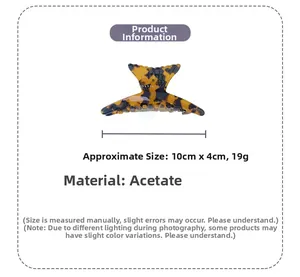 Detailed view of leopard pattern acetate hair claw clip with size dimensions 10cm x 4cm