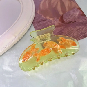 Unique acetate shark hair claw clip featuring 3D goldfish design for elegant summer styling