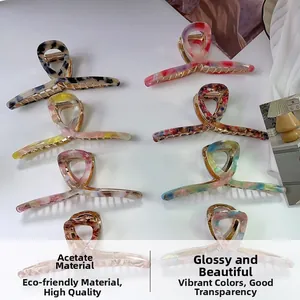 Detail of 13.5cm oversized acetate hair claws with premium marble and tortoiseshell patterns