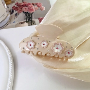Elegant cream flower hair claw with pink rhinestones and 3D floral accents for women