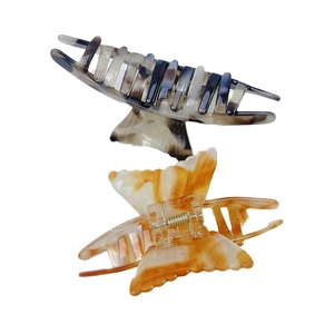 Elegant fishtail acetate hair claw clips set with black marble and amber patterns